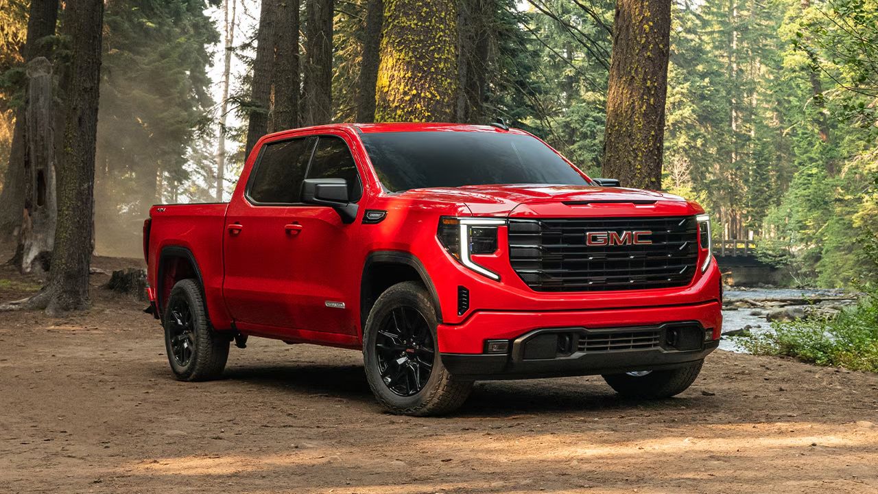 Front three-quarter view of a 2026 GMC Sierra 1500 in a forest