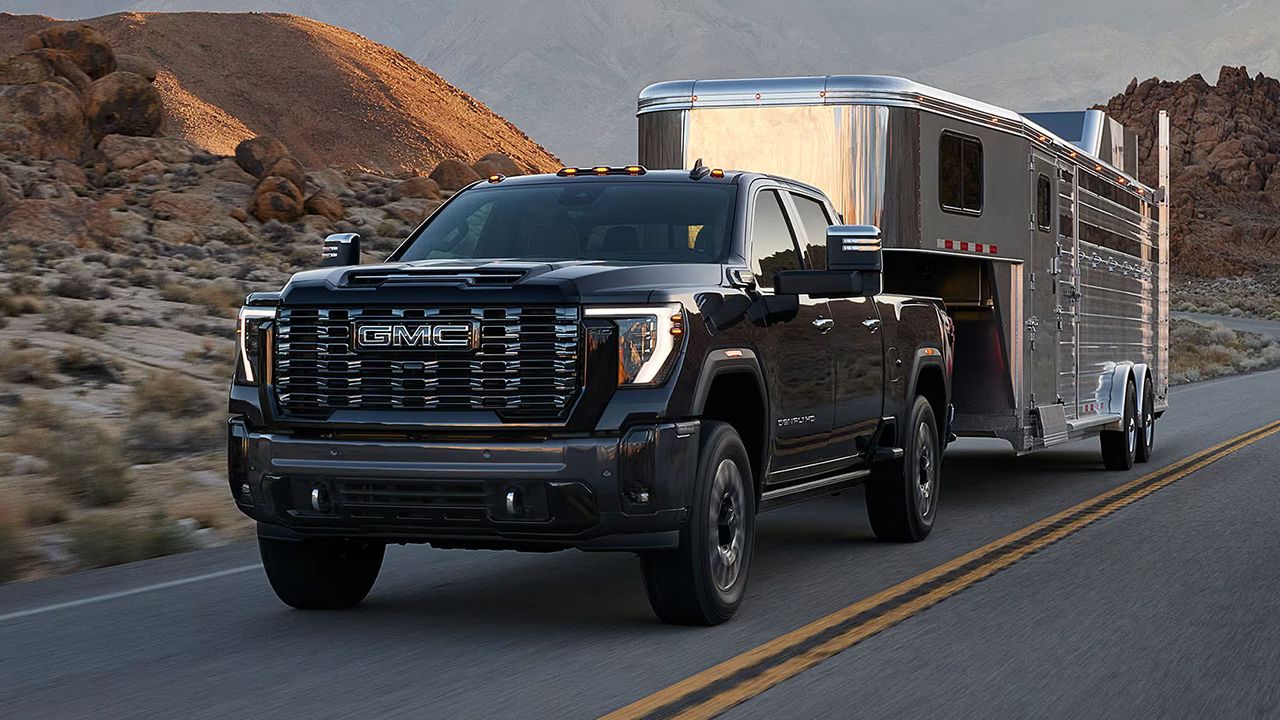 2026 GMC Sierra 2500 HD towing a travel trailer