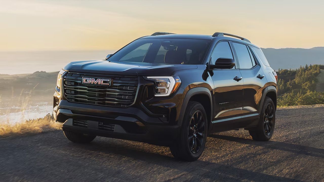 2026 GMC Terrain viewed from the front three-quarter angle on the road